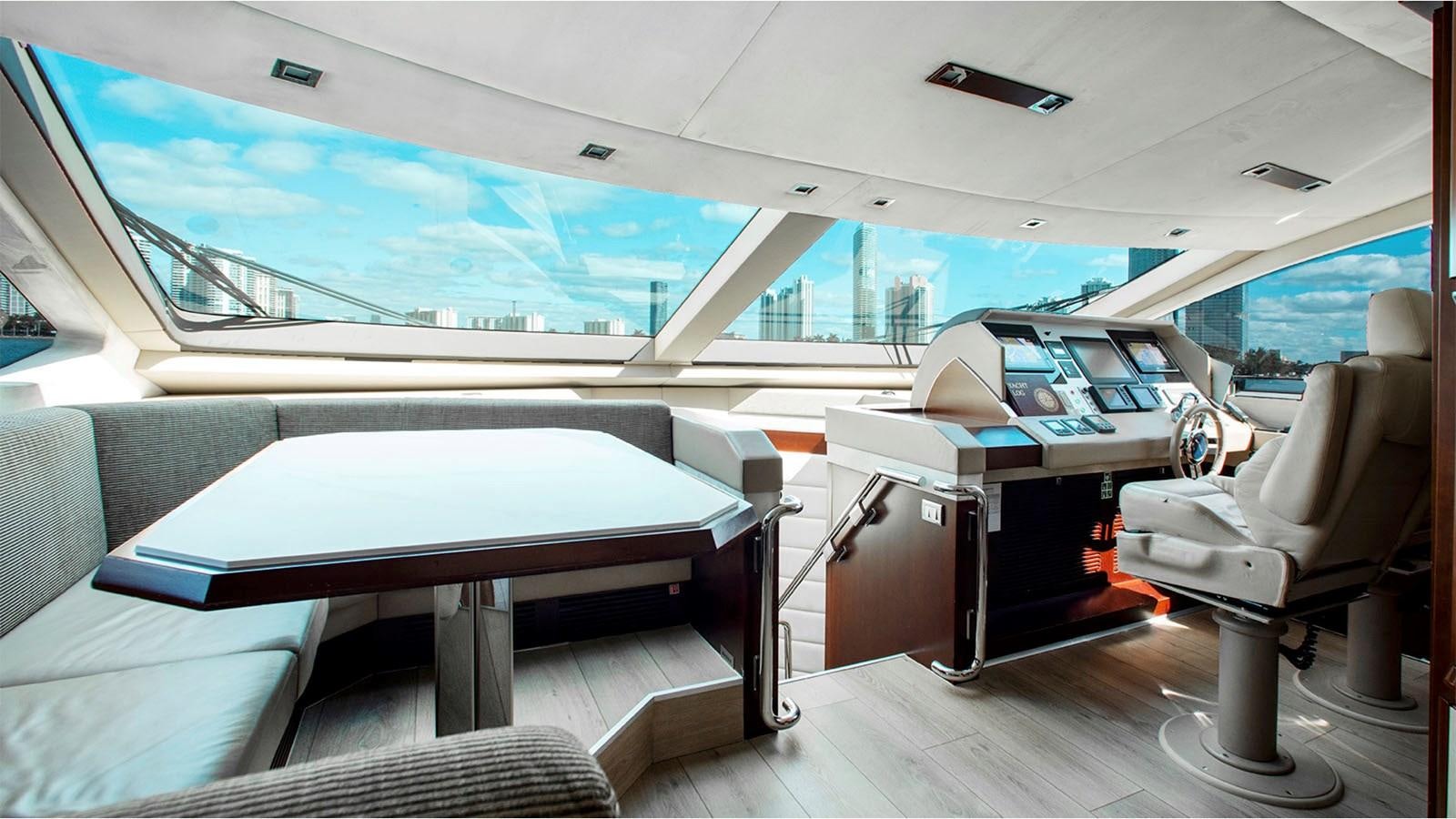 a room with a table and chairs aboard BT 2 Yacht for Sale