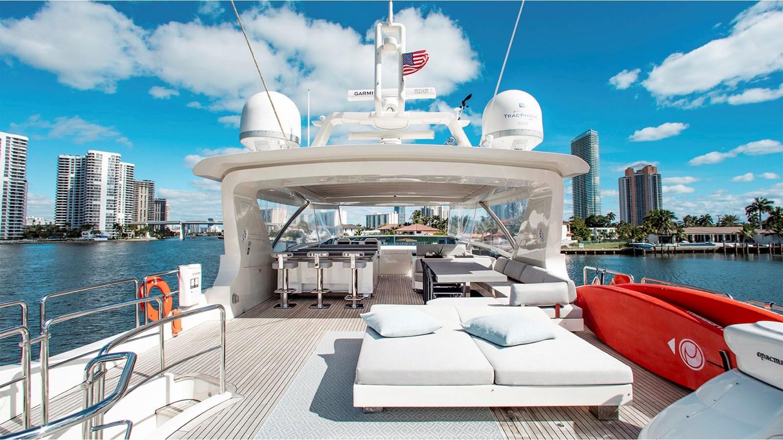 a large white boat on a dock aboard BT 2 Yacht for Sale