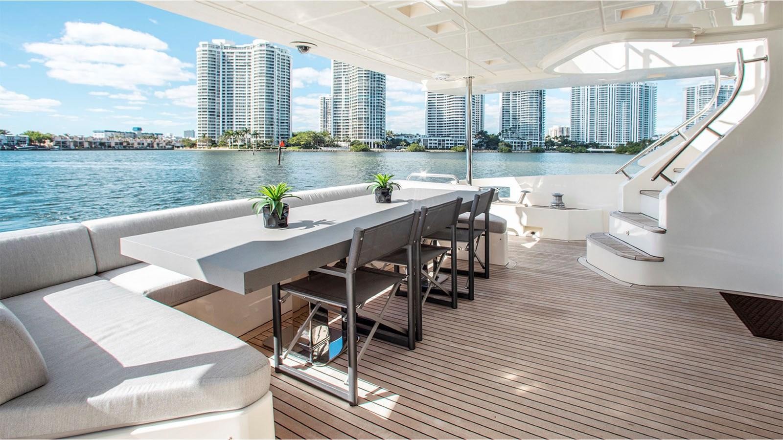 a room with a table and chairs aboard BT 2 Yacht for Sale