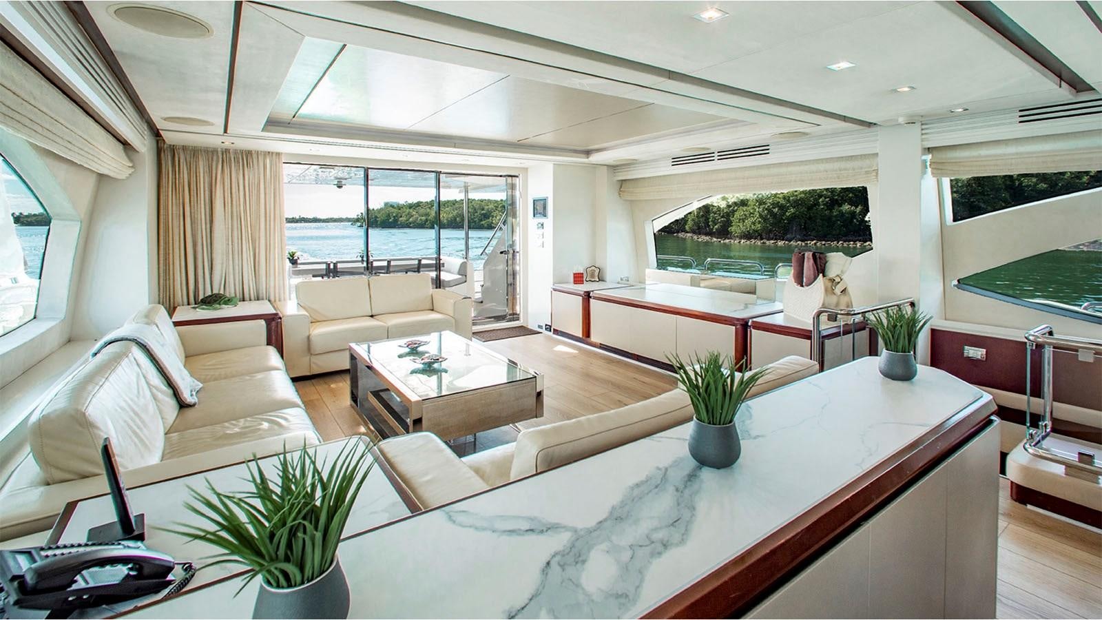 a living room with a large window aboard BT 2 Yacht for Sale