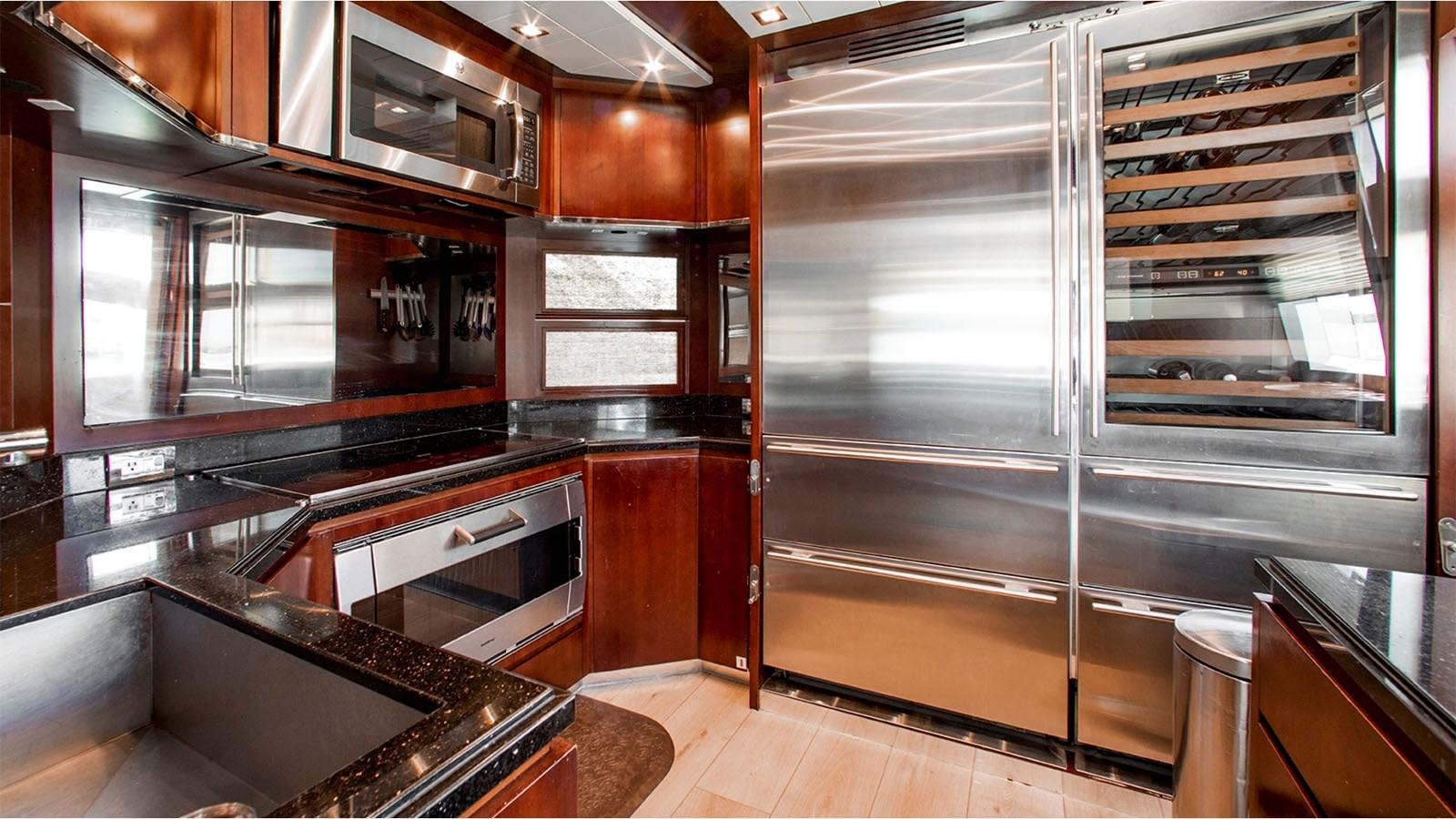 a kitchen with a large glass door aboard BT 2 Yacht for Sale