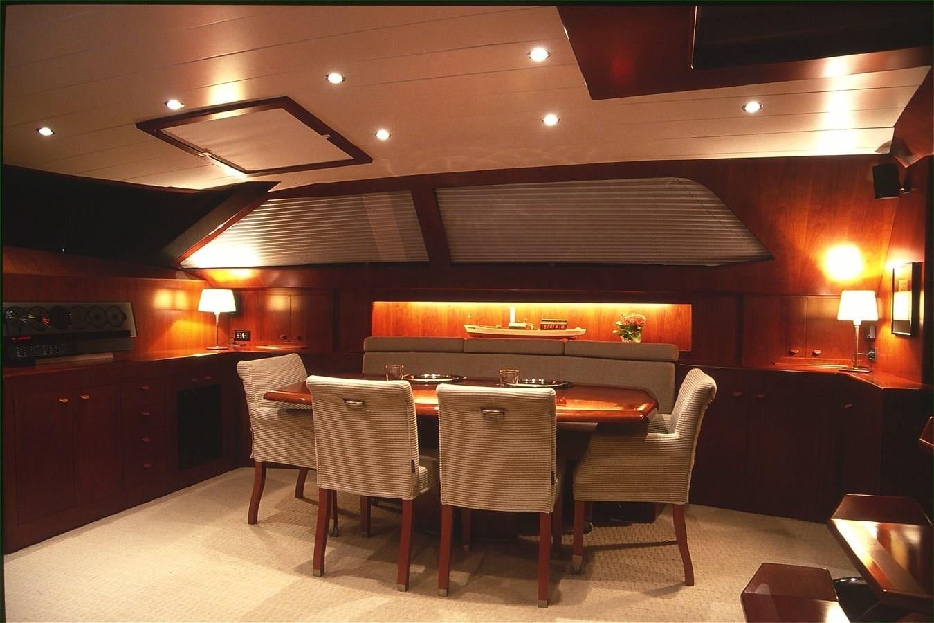 a large room with a table and chairs aboard FREE AT LAST Yacht for Sale