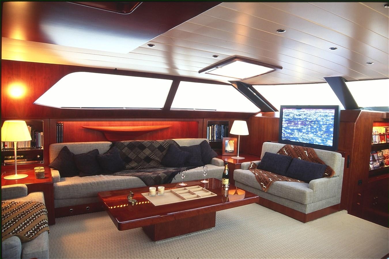 a living room with a large sofa aboard FREE AT LAST Yacht for Sale