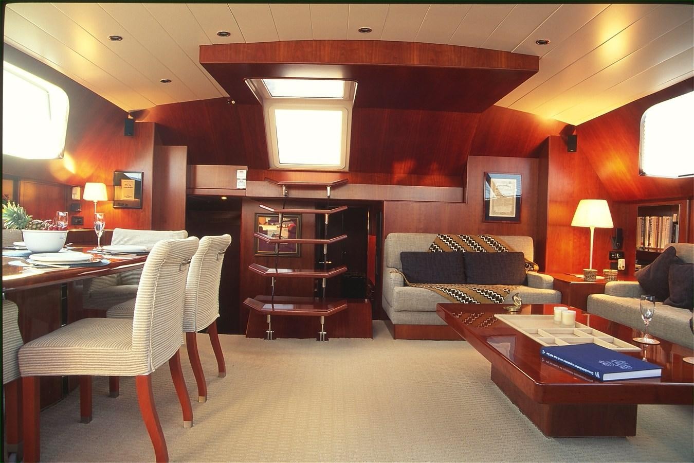 a living room with a couch and a table aboard FREE AT LAST Yacht for Sale