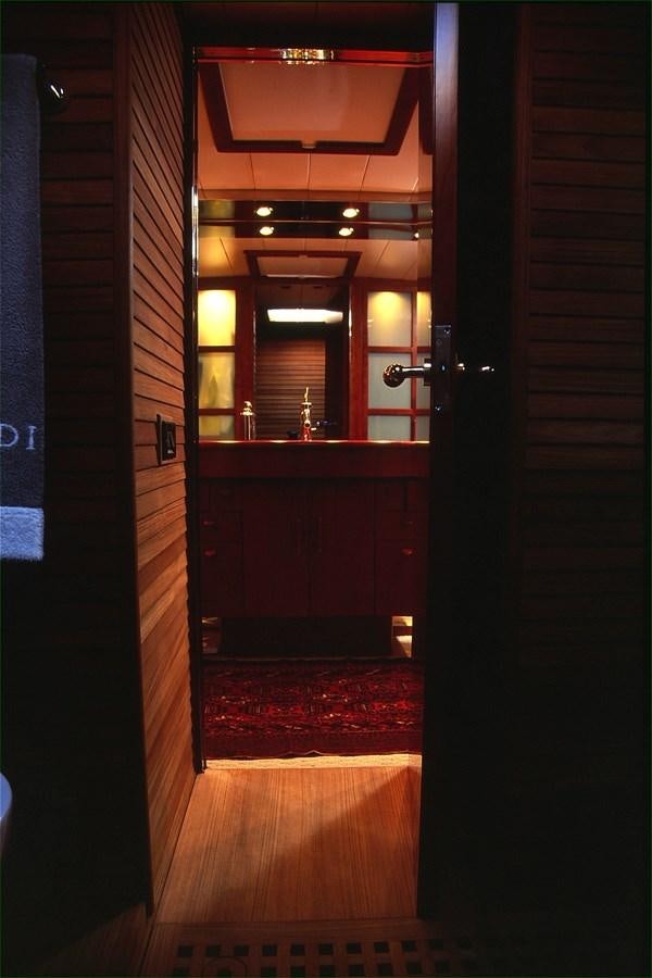 a room with a wood door and a mirror aboard FREE AT LAST Yacht for Sale