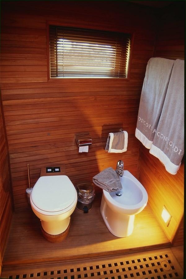 a bathroom with a toilet and sink aboard FREE AT LAST Yacht for Sale