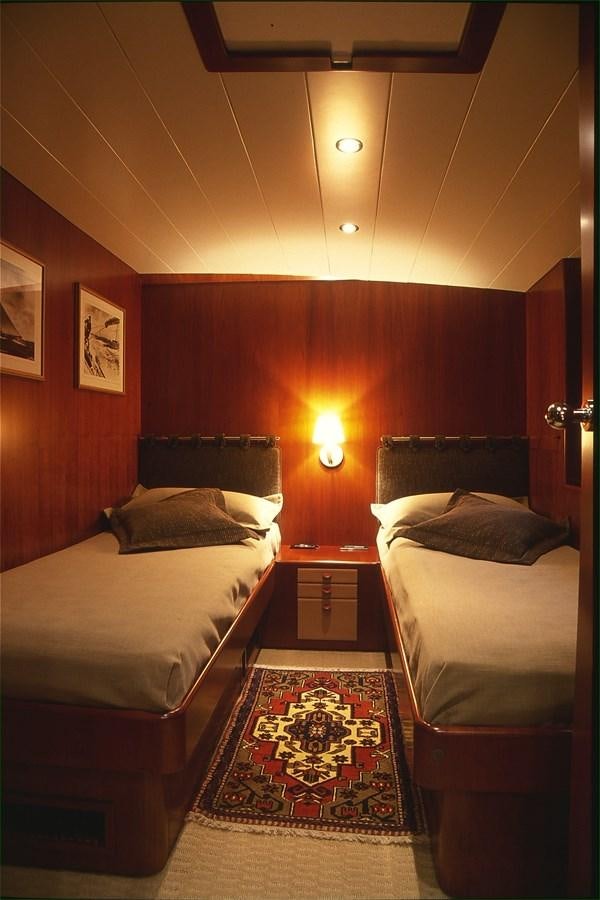a couple of beds in a hotel room aboard FREE AT LAST Yacht for Sale