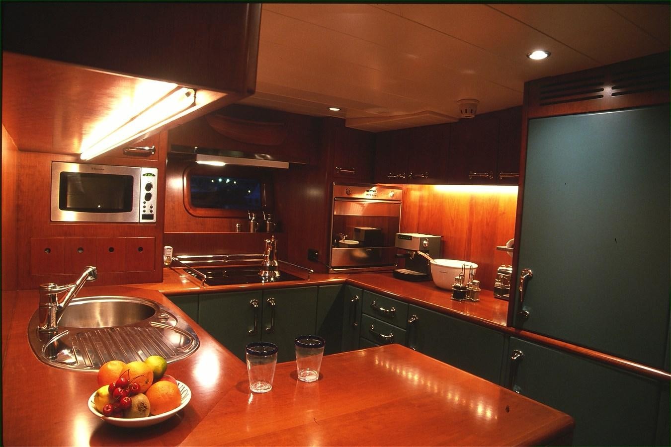 a kitchen with a sink and microwave aboard FREE AT LAST Yacht for Sale