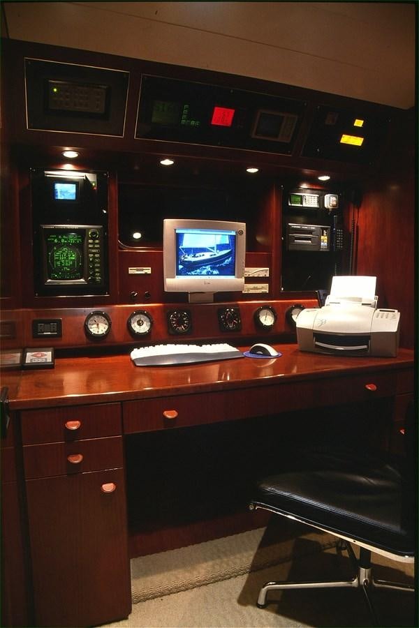 a control panel with a monitor and keyboard aboard FREE AT LAST Yacht for Sale