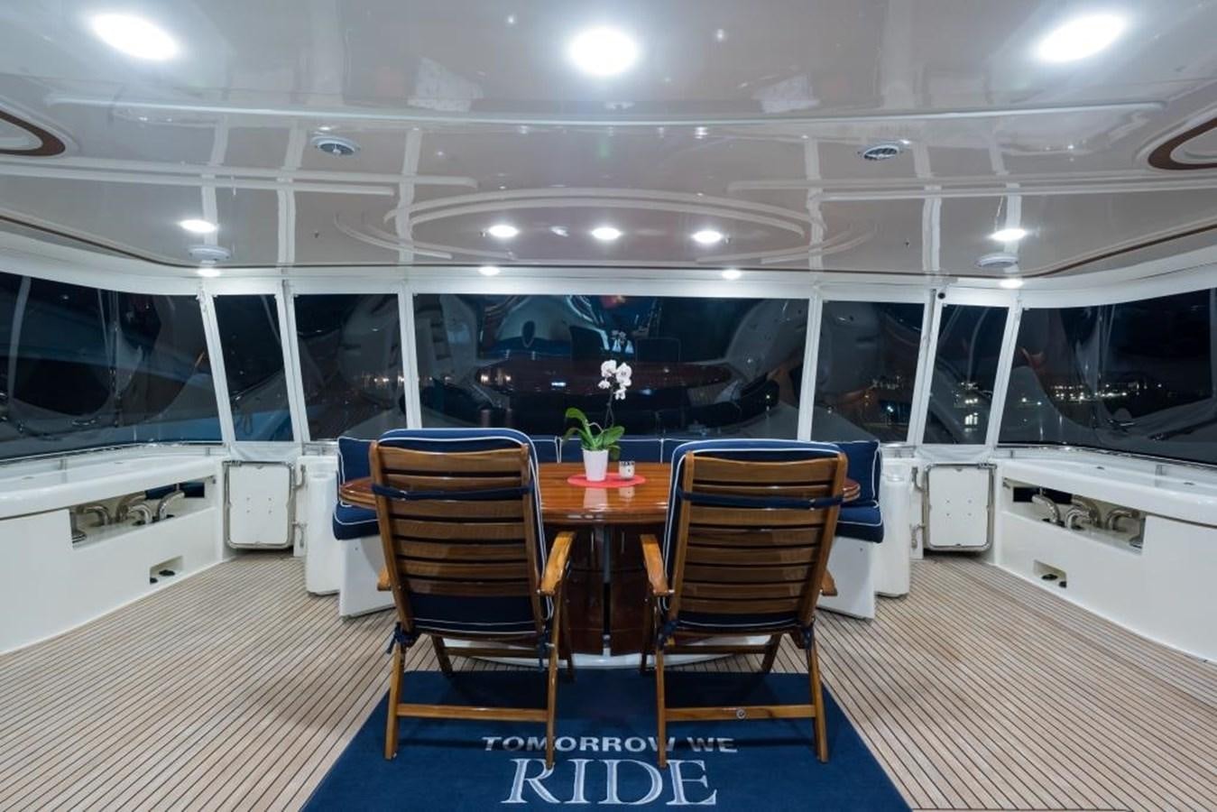 a room with a table and chairs aboard TOMORROW WE RIDE Yacht for Sale