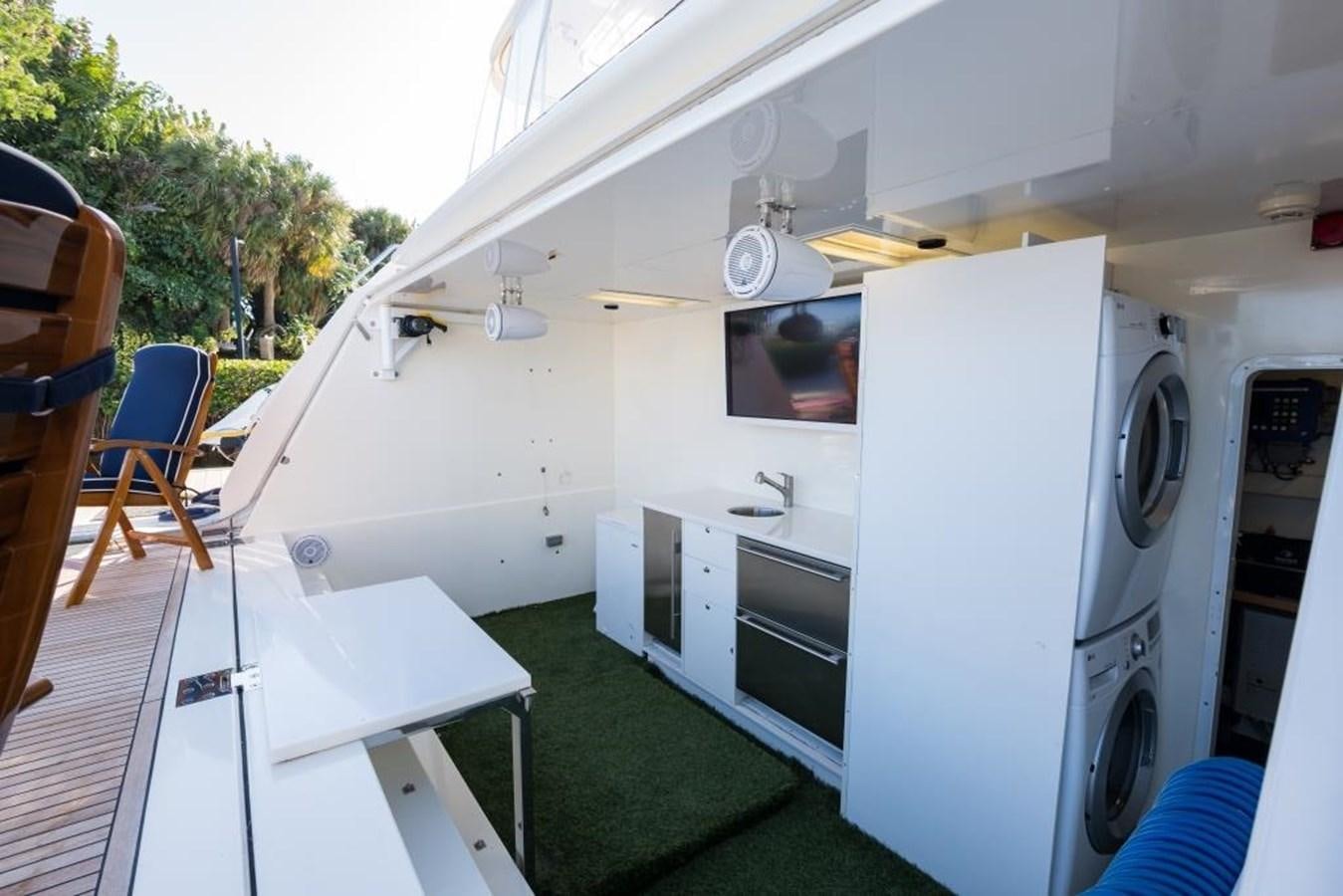 a white trailer with a green lawn aboard TOMORROW WE RIDE Yacht for Sale
