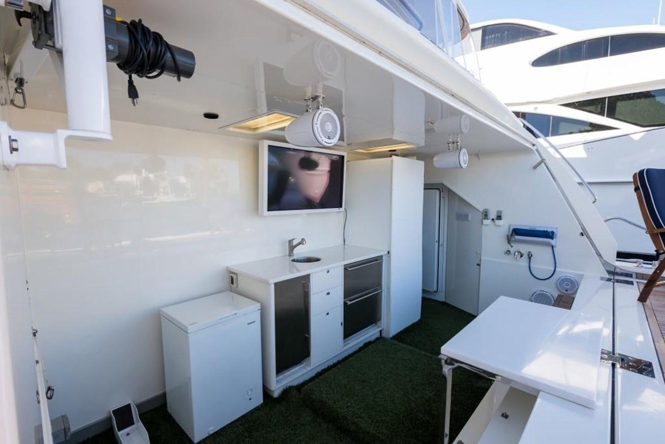 a room with a television and a table aboard TOMORROW WE RIDE Yacht for Sale