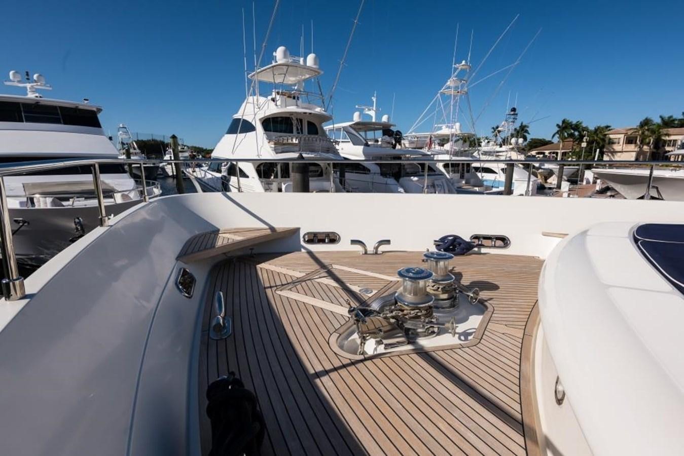 a deck with a large ship in the background aboard TOMORROW WE RIDE Yacht for Sale