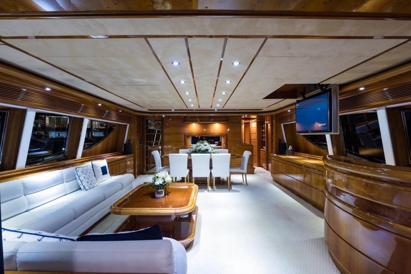 a room with a table and couches aboard TOMORROW WE RIDE Yacht for Sale