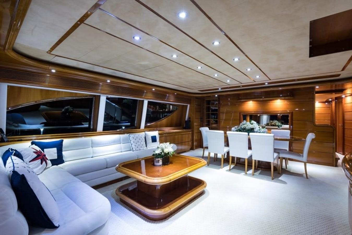 a room with a couch and a table and chairs aboard TOMORROW WE RIDE Yacht for Sale
