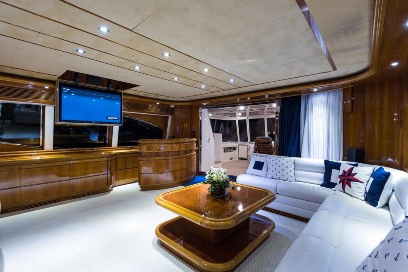 a living room with a large television aboard TOMORROW WE RIDE Yacht for Sale