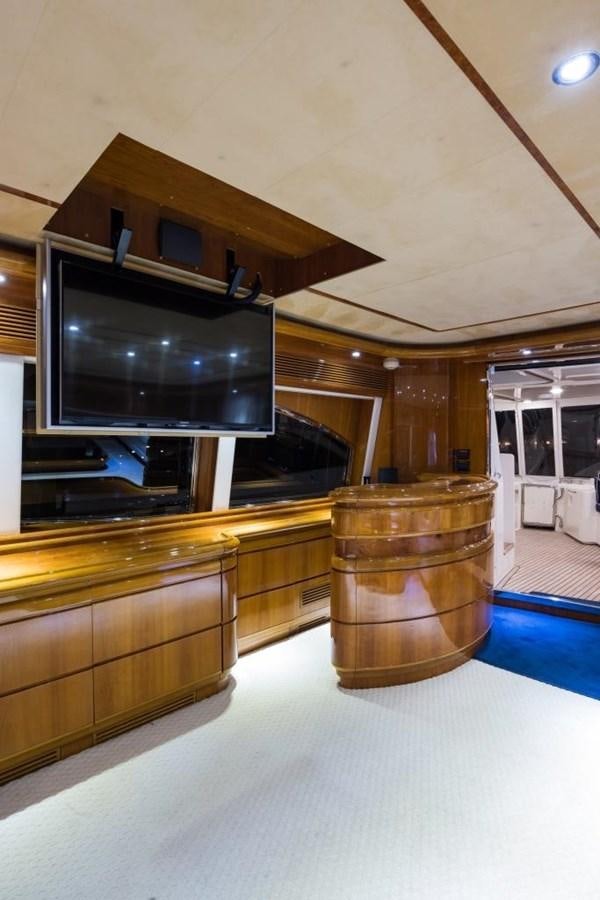 a large tv on a stand aboard TOMORROW WE RIDE Yacht for Sale