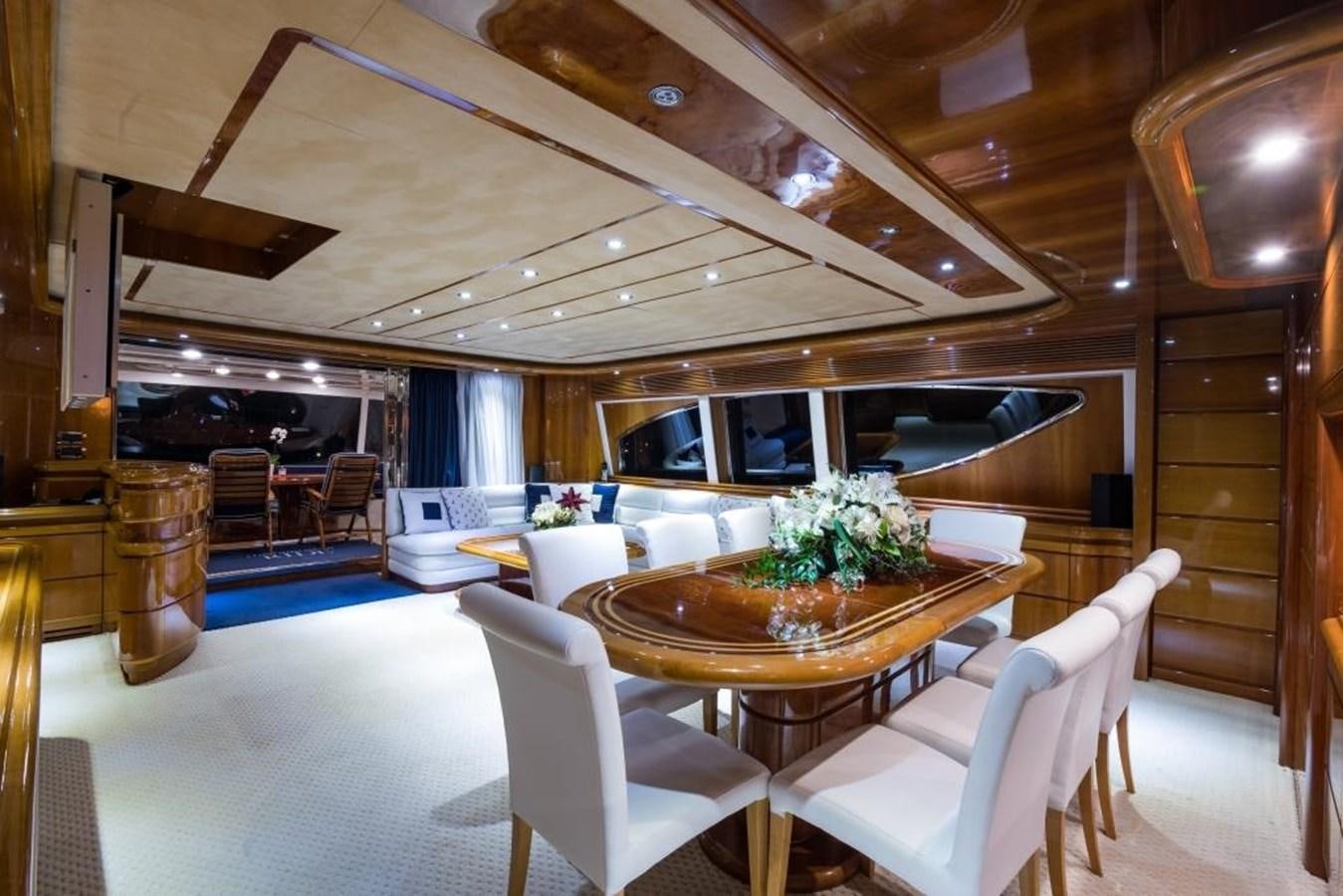 a dining room with a table and chairs aboard TOMORROW WE RIDE Yacht for Sale