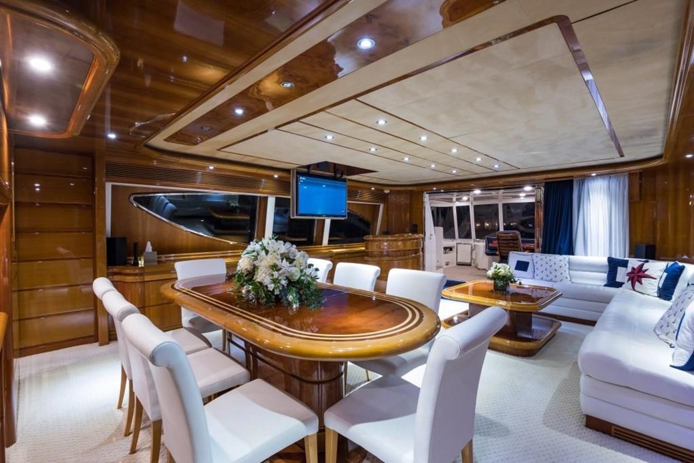 a living room with a table and chairs aboard TOMORROW WE RIDE Yacht for Sale