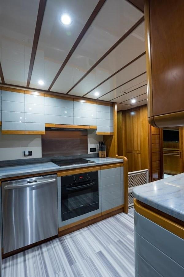 a kitchen with a stove and oven aboard TOMORROW WE RIDE Yacht for Sale