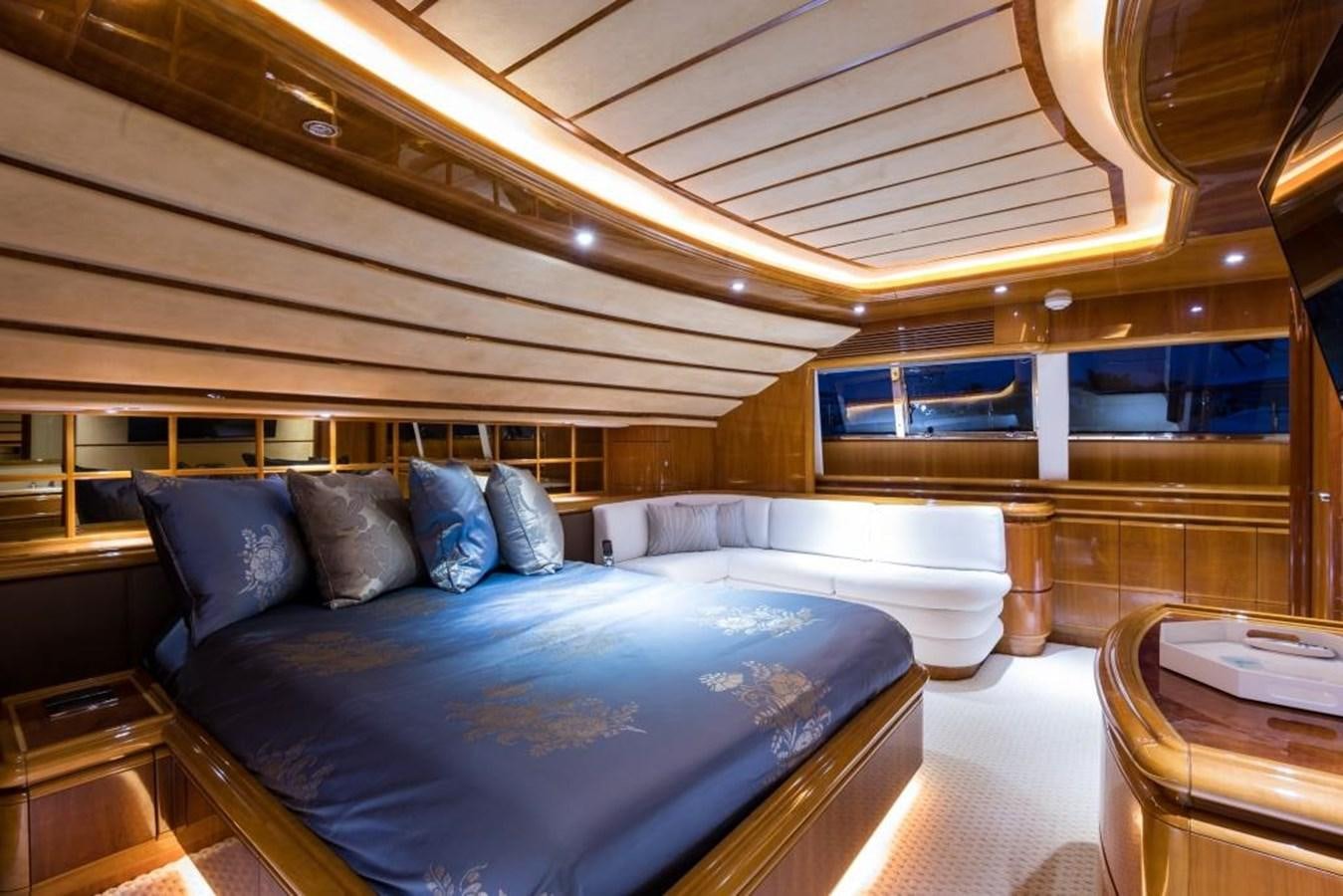 a room with a bed and a table aboard TOMORROW WE RIDE Yacht for Sale