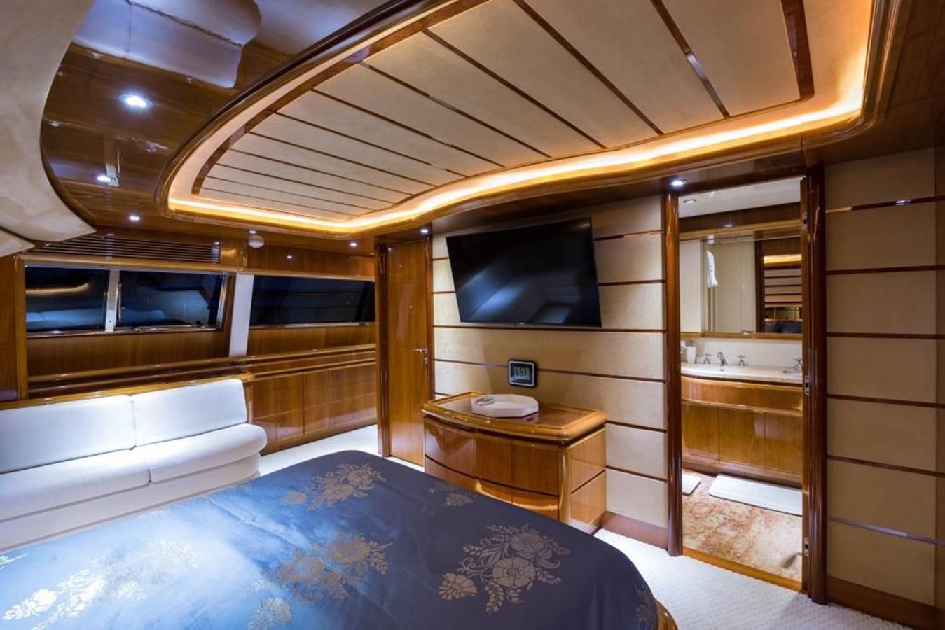 a room with a bed and a tv aboard TOMORROW WE RIDE Yacht for Sale