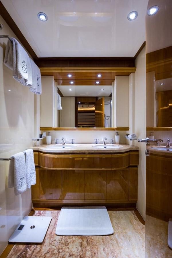 a bathroom with a sink and a mirror aboard TOMORROW WE RIDE Yacht for Sale