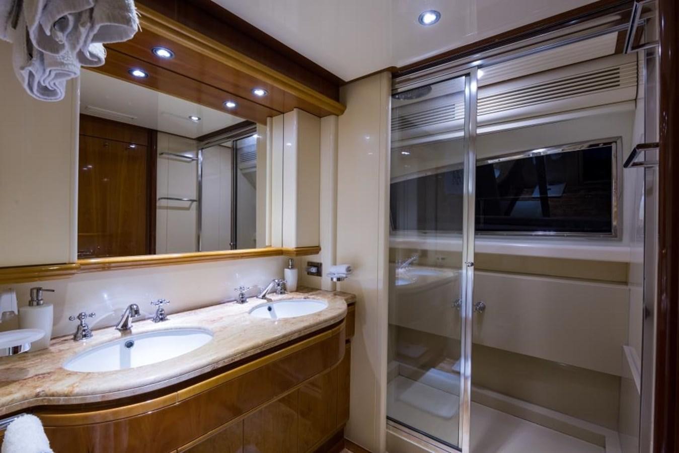 a bathroom with a sink and a mirror aboard TOMORROW WE RIDE Yacht for Sale