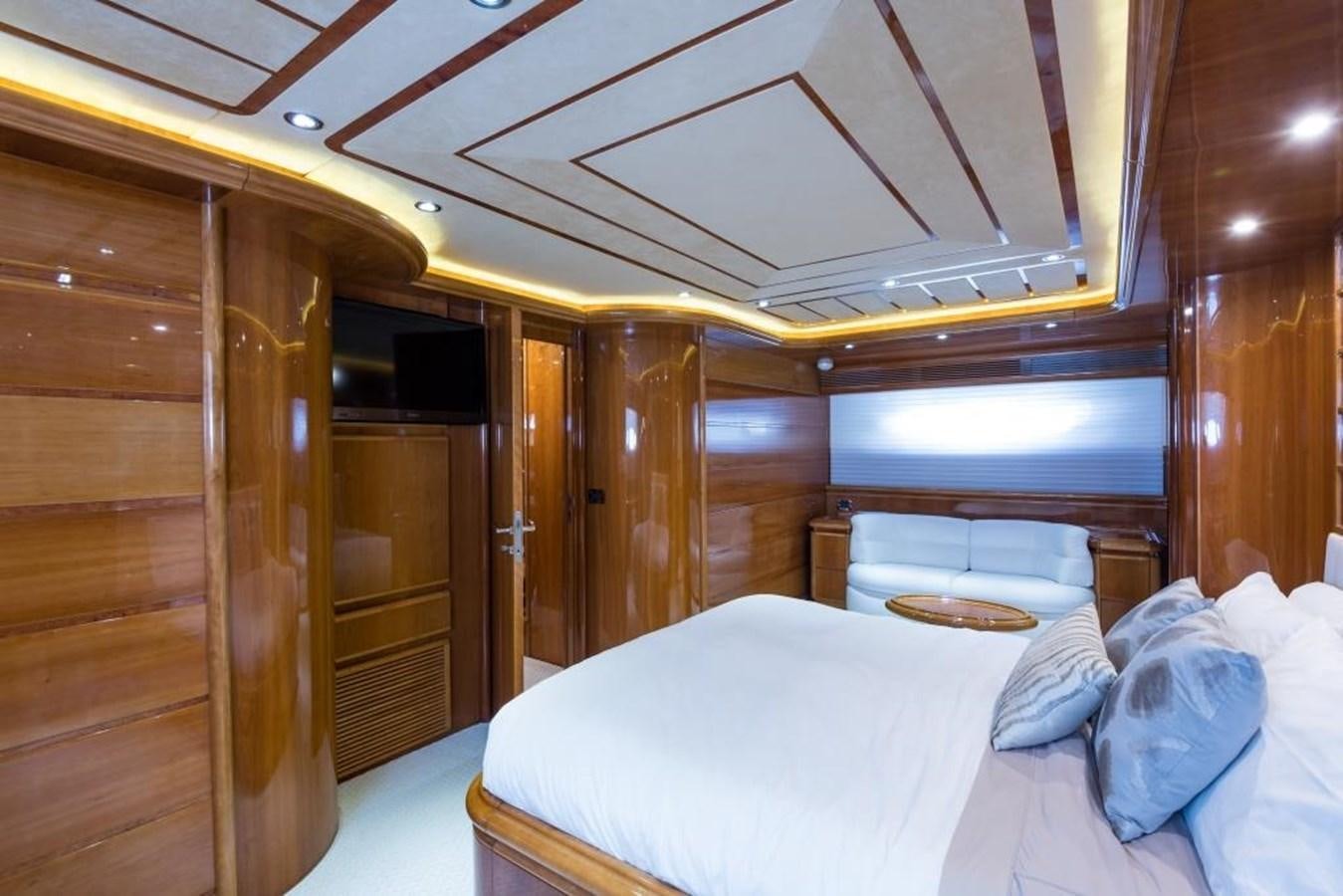 a room with a bed and a wood wall aboard TOMORROW WE RIDE Yacht for Sale