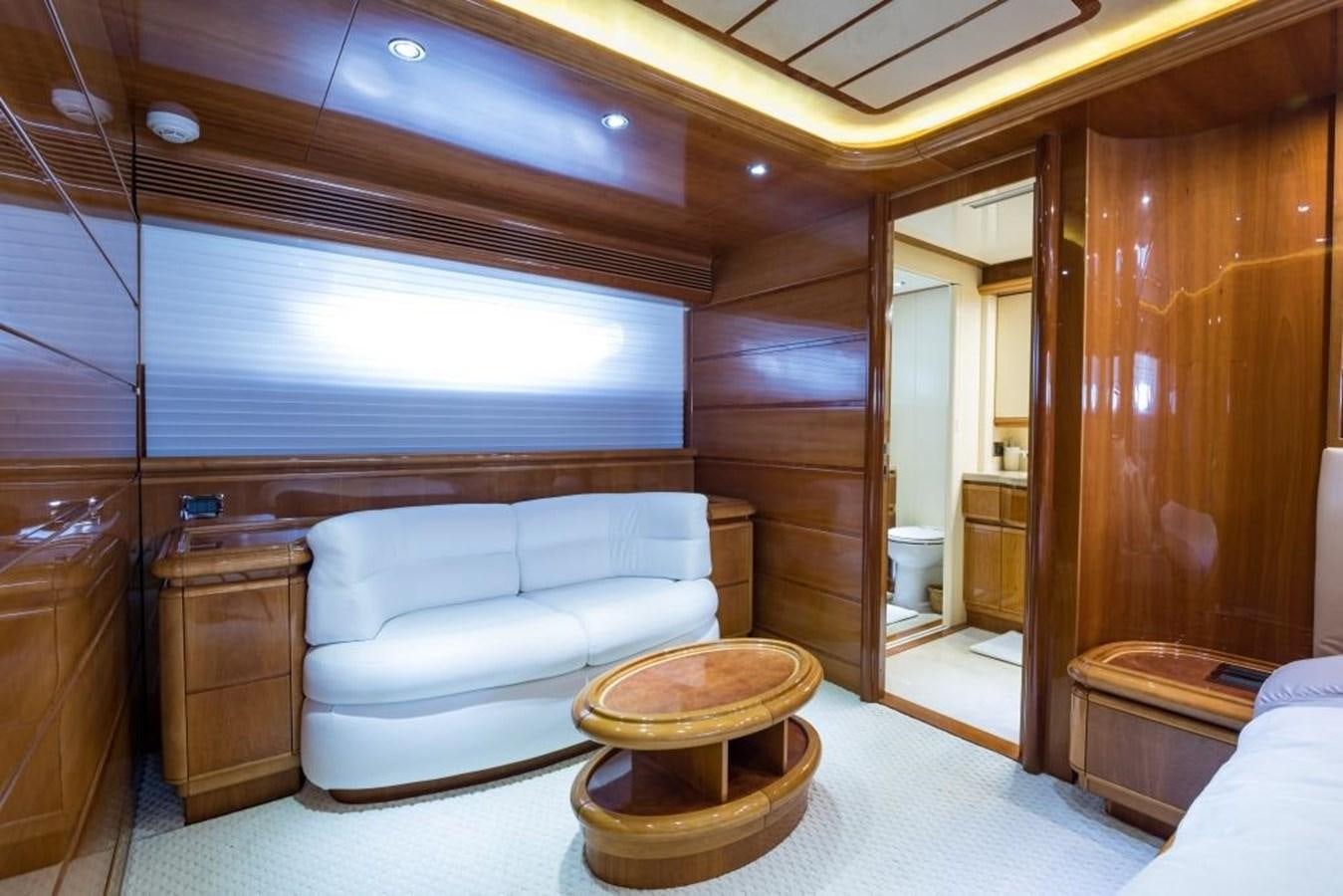a room with a couch and a table aboard TOMORROW WE RIDE Yacht for Sale
