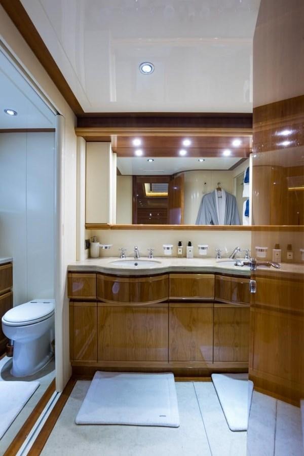 a bathroom with a large mirror aboard TOMORROW WE RIDE Yacht for Sale