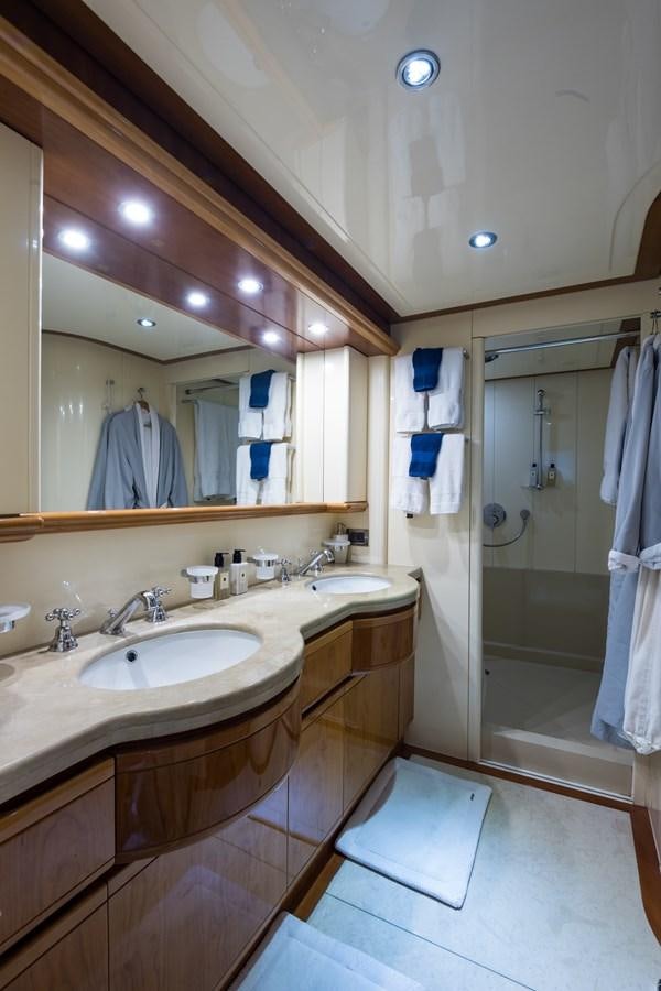 a bathroom with a large mirror aboard TOMORROW WE RIDE Yacht for Sale