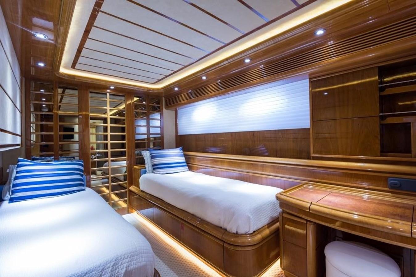 a room with a bed and a large window aboard TOMORROW WE RIDE Yacht for Sale