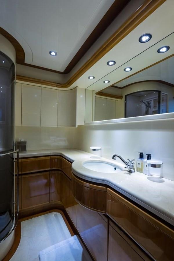 a bathroom with a sink and a mirror aboard TOMORROW WE RIDE Yacht for Sale