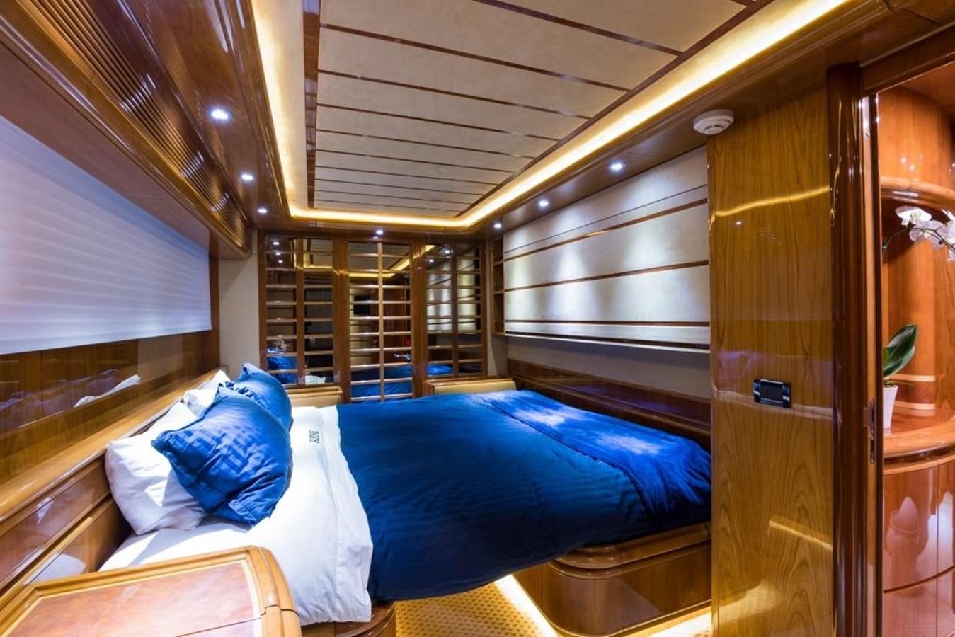 a room with a bed and a closet aboard TOMORROW WE RIDE Yacht for Sale