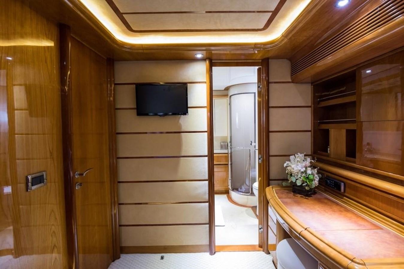 a room with a bed and a tv on the wall aboard TOMORROW WE RIDE Yacht for Sale