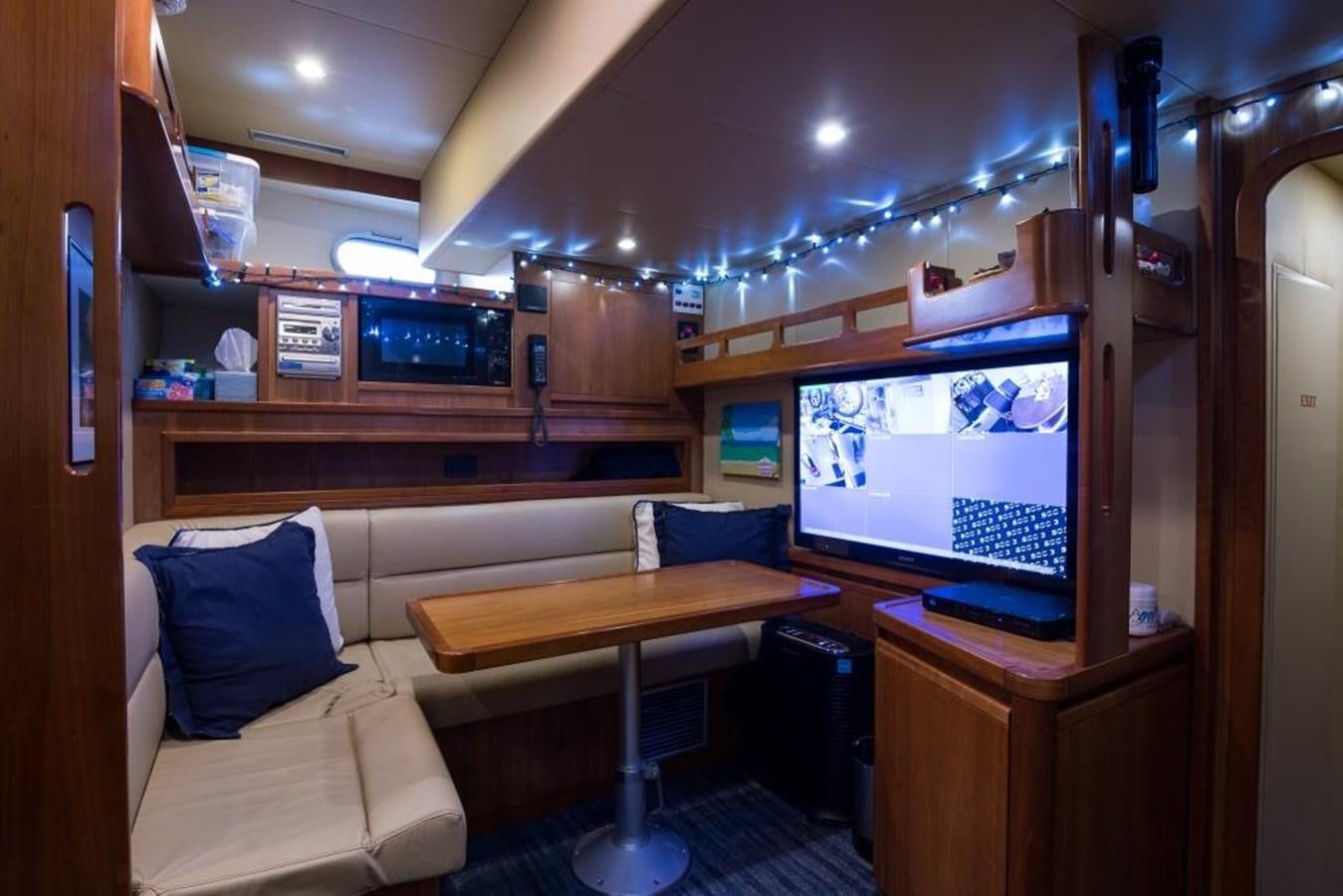 a room with a bed and a desk and a tv aboard TOMORROW WE RIDE Yacht for Sale