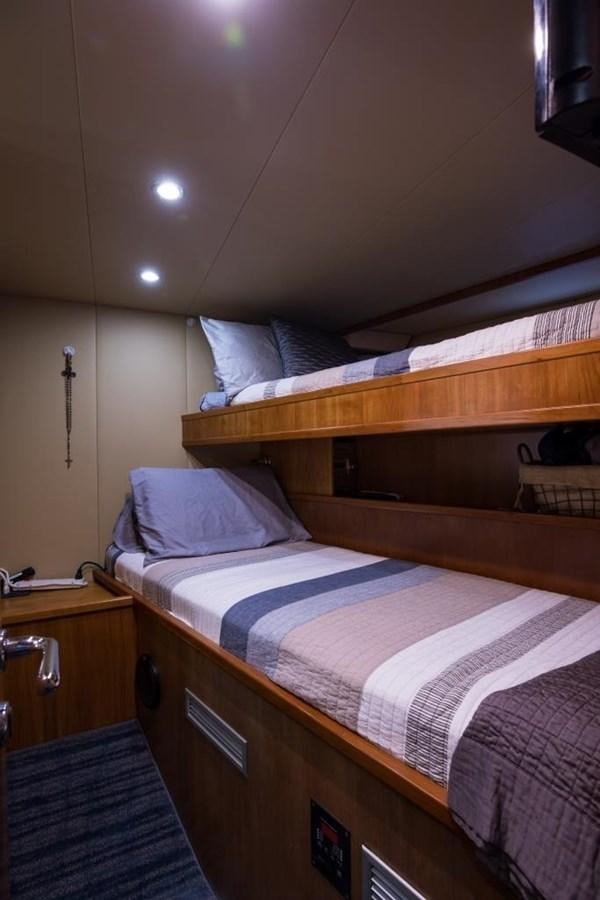 a bed with a couple of beds aboard TOMORROW WE RIDE Yacht for Sale