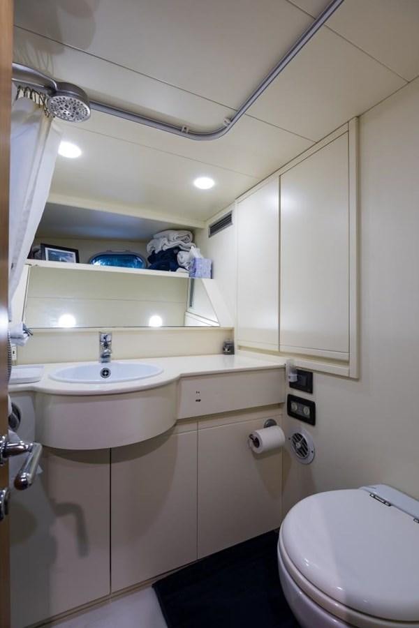 a bathroom with a sink and a toilet aboard TOMORROW WE RIDE Yacht for Sale