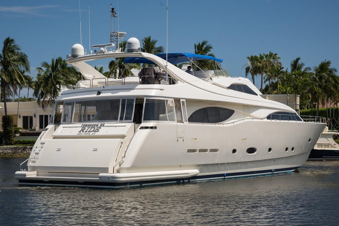 a white boat on the water aboard TOMORROW WE RIDE Yacht for Sale