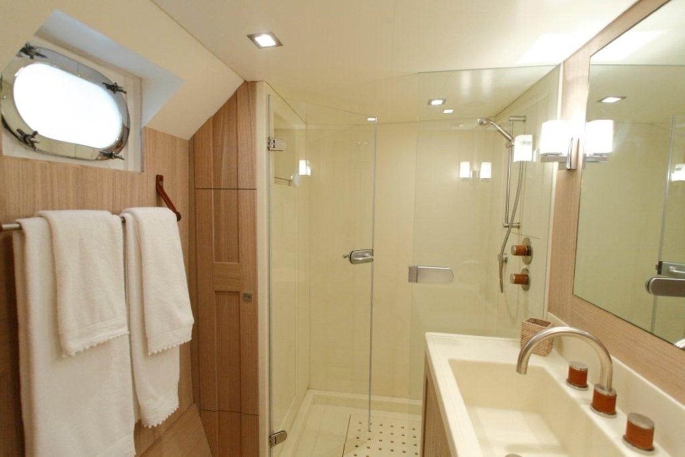 a bathroom with a shower and sink aboard CONQUEST OF 1966 Yacht for Sale