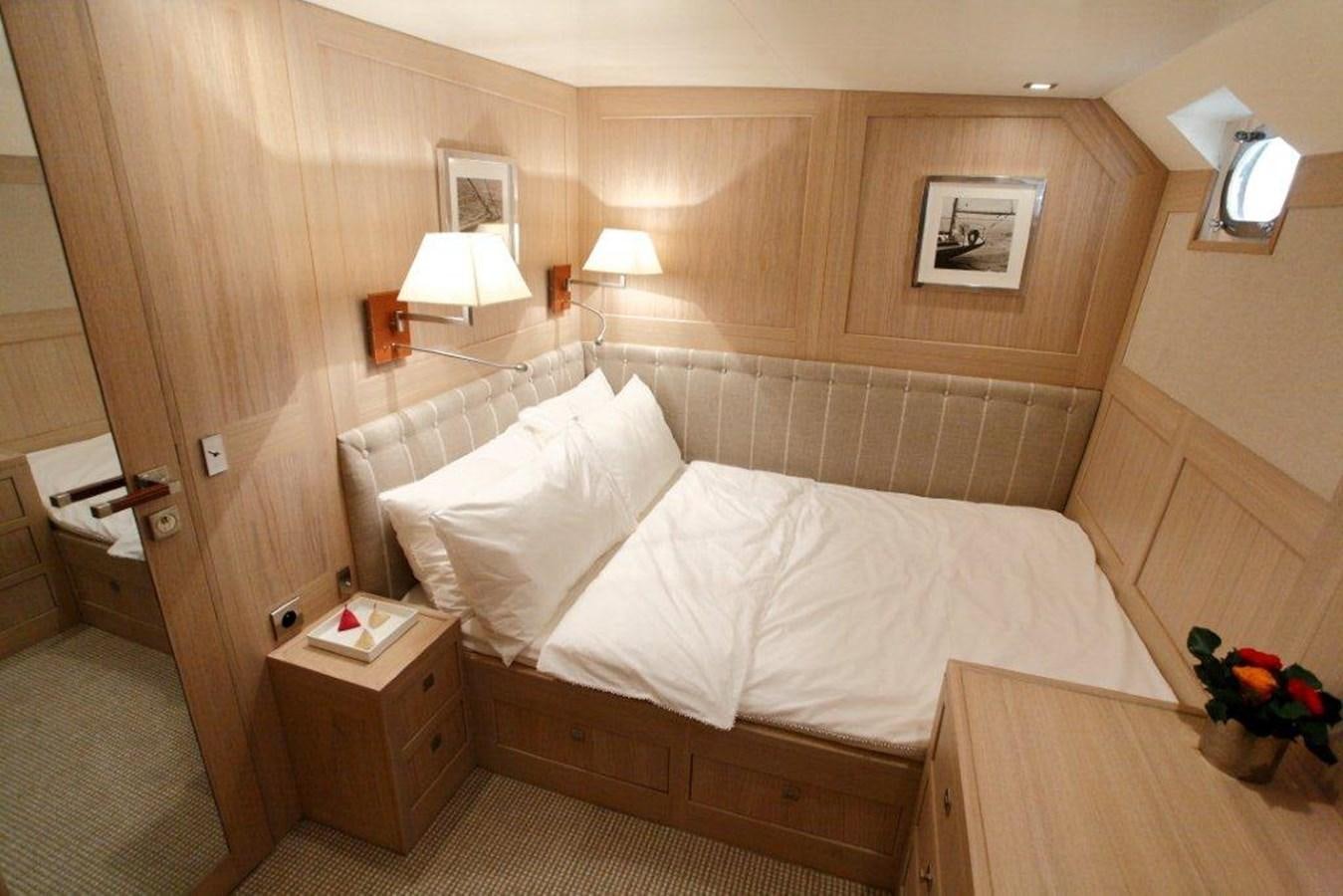 a bed with white sheets aboard CONQUEST OF 1966 Yacht for Sale