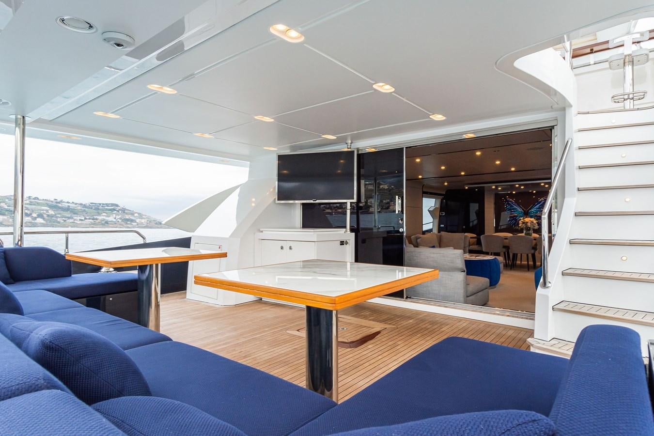 a room with a table and chairs aboard SOLSTICE Yacht for Sale
