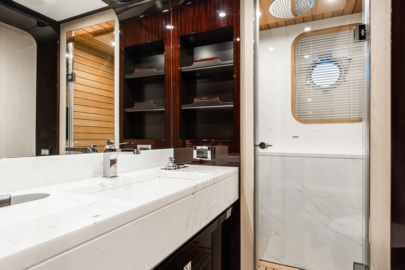 a bathroom with a sink and a mirror aboard SOLSTICE Yacht for Sale