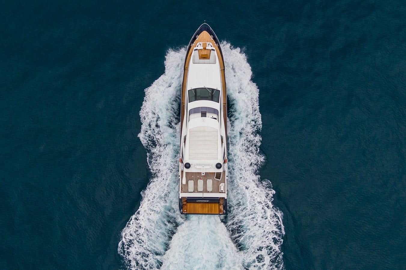 a white and orange boat in the water aboard SOLSTICE Yacht for Sale