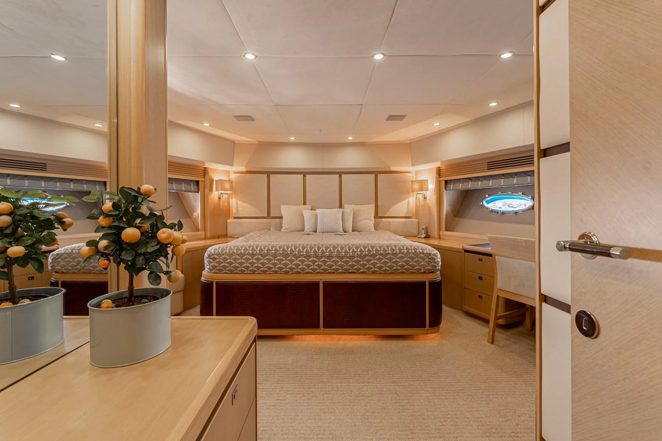 a bedroom with a bed and a plant aboard BLUE EYES Yacht for Sale