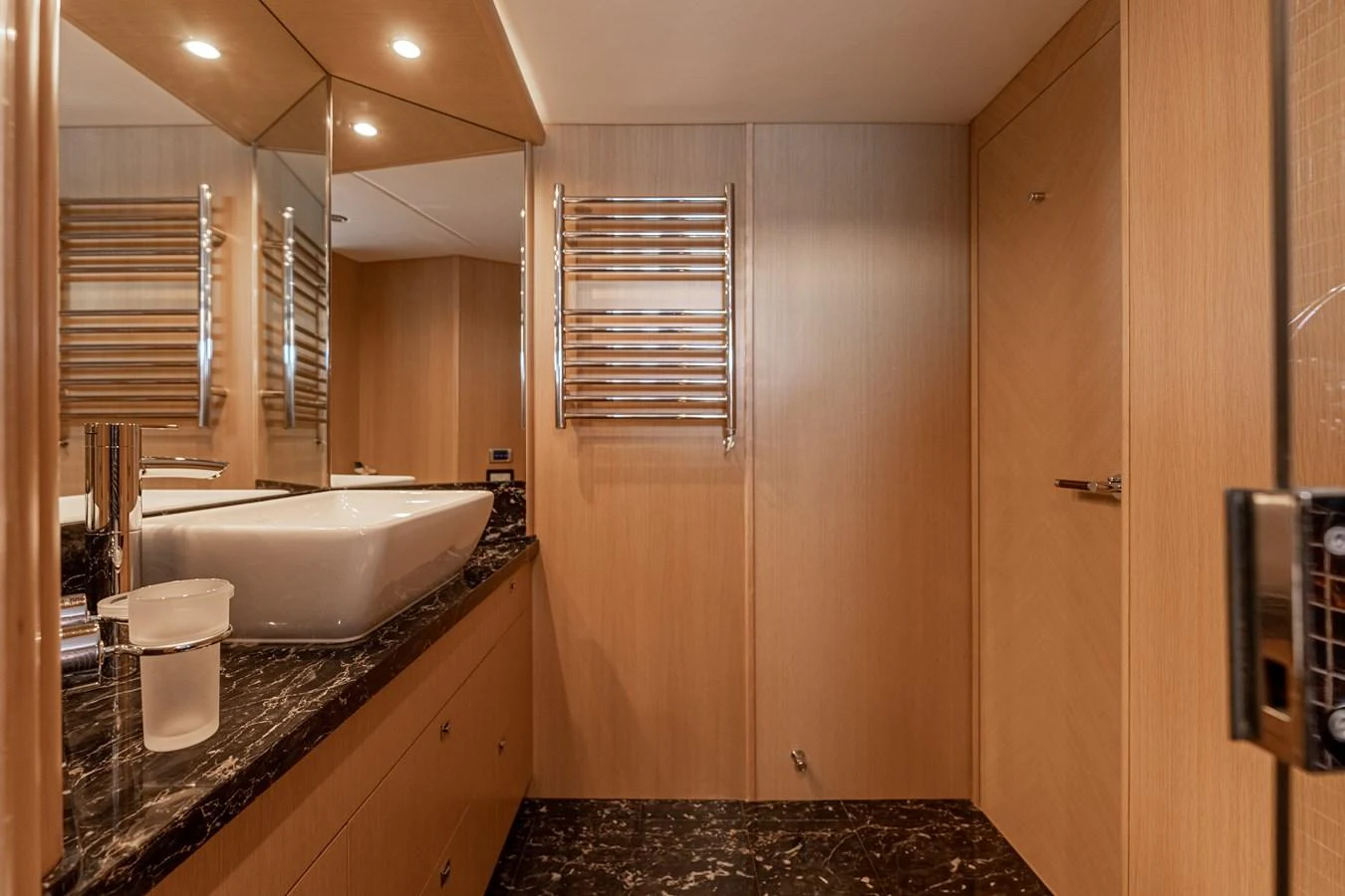 a bathroom with a tub sink and cabinets aboard BLUE EYES Yacht for Sale