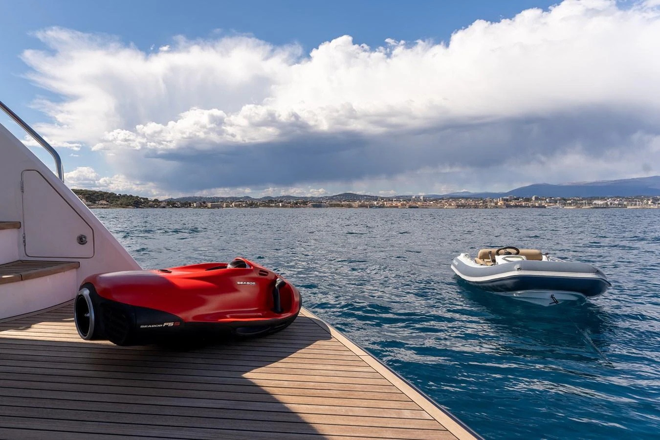a red and white boat on a body of water aboard BLUE EYES Yacht for Sale