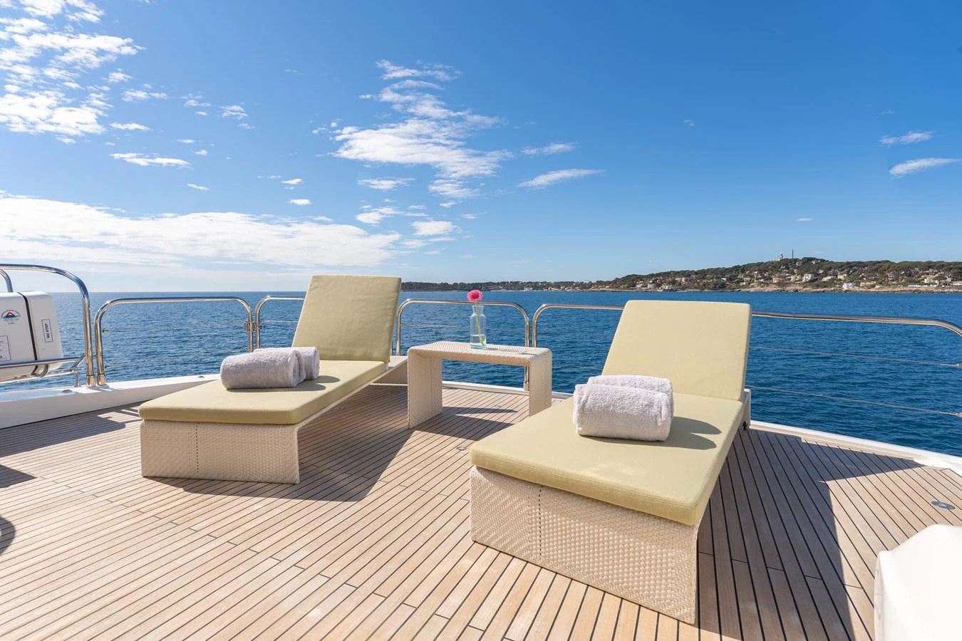 a deck with chairs on it by a body of water aboard BLUE EYES Yacht for Sale