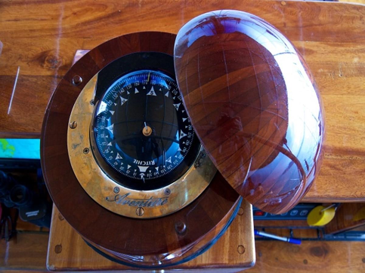a clock with a large pink and white balloon on it aboard AVENTURE Yacht for Sale